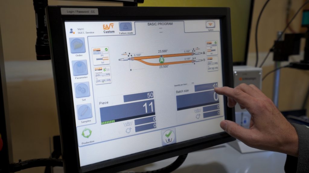 Multi-Tek employee interacting with production software